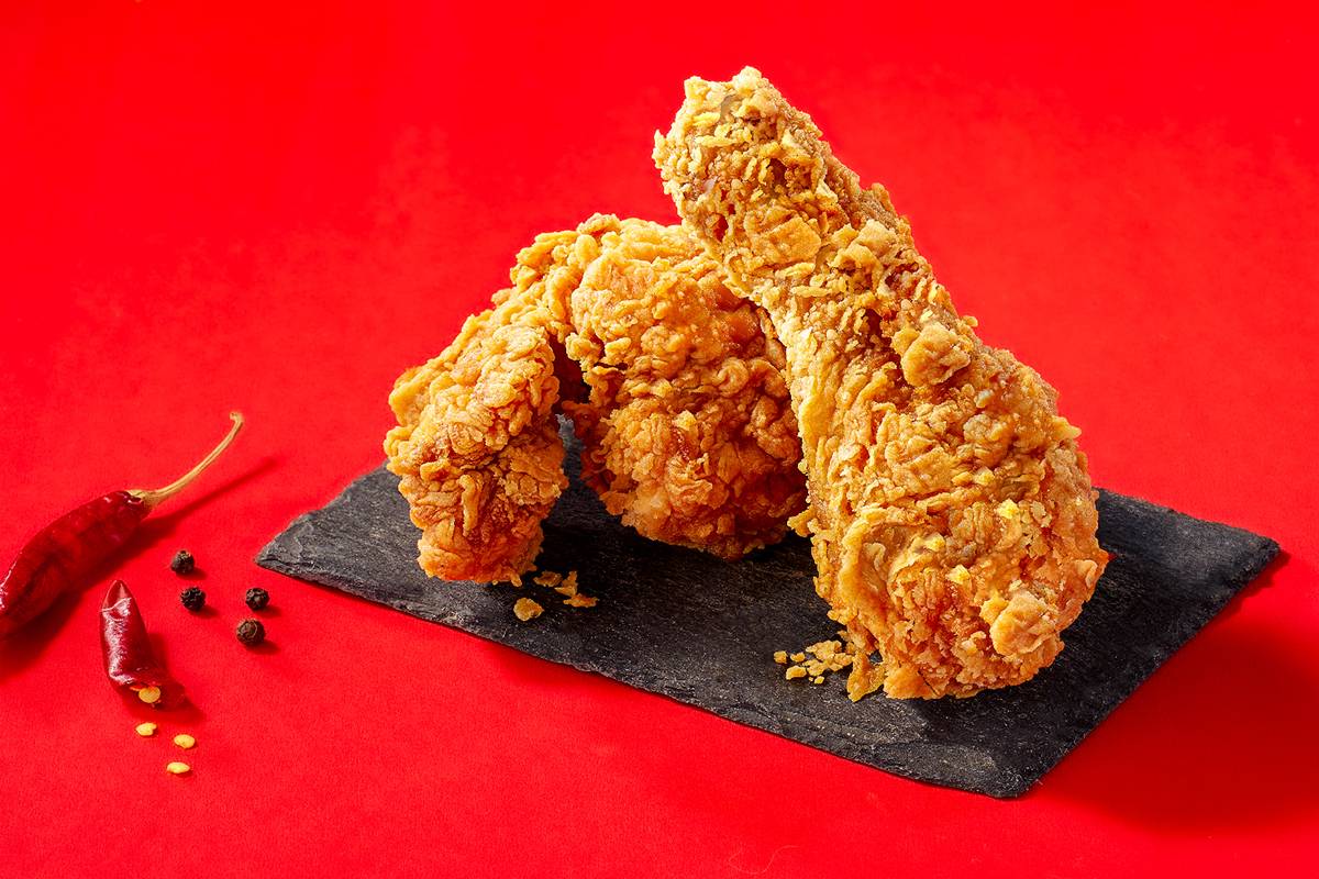 Crispy fried chicken served on a plate with golden crust from FIVE STAR CHICKEN in Hyderabad, showcasing its spicy and flavor
