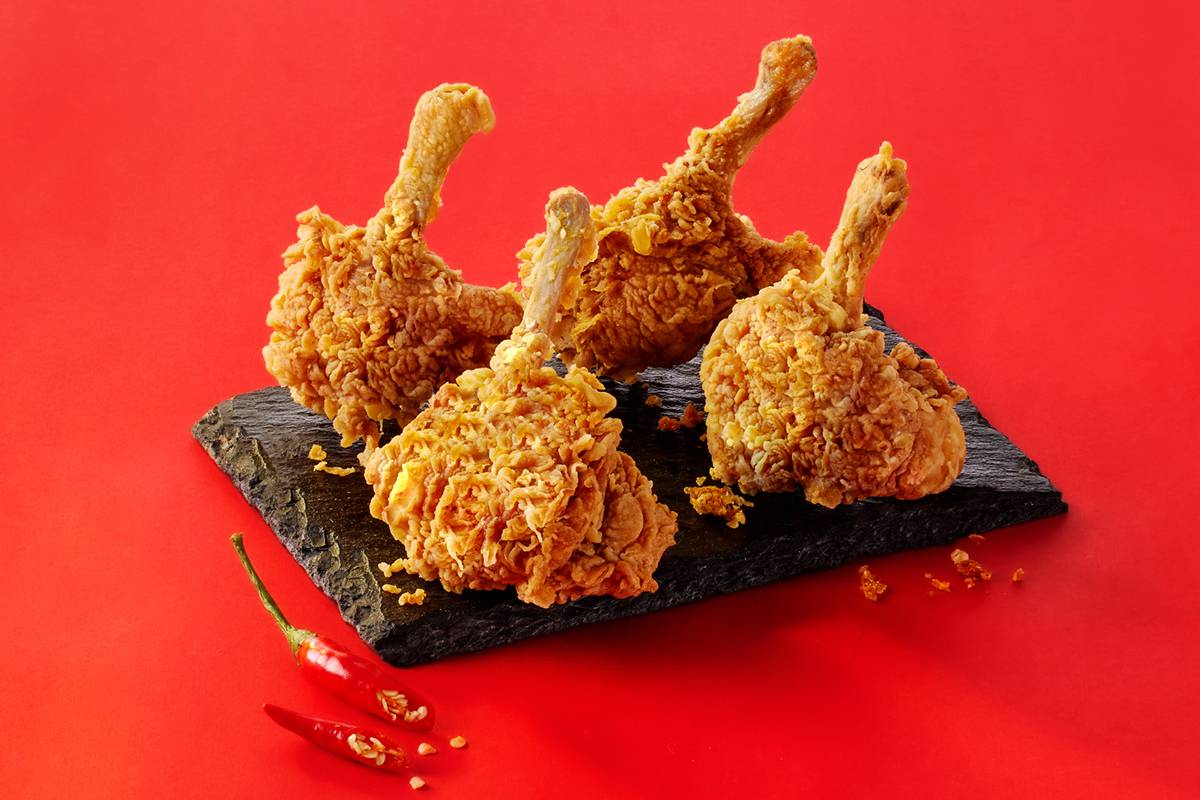 Crispy and spicy fried chicken drumsticks, known as Spicy Fried Chicken LOLIPOP, served in Hyderabad with a crunchy coating.
