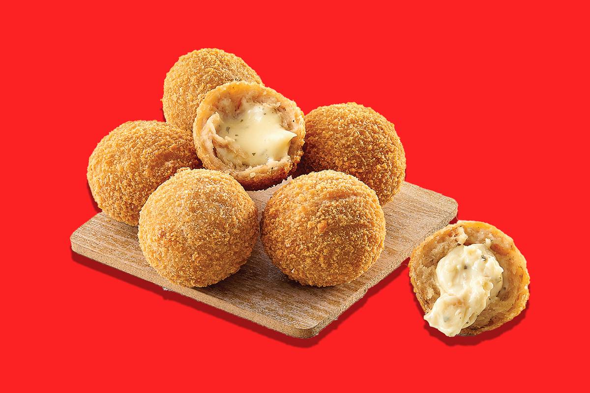 Crispy golden cheese balls filled with creamy cheese from FIVE STAR CHICKEN in Hyderabad, perfect for snacking.