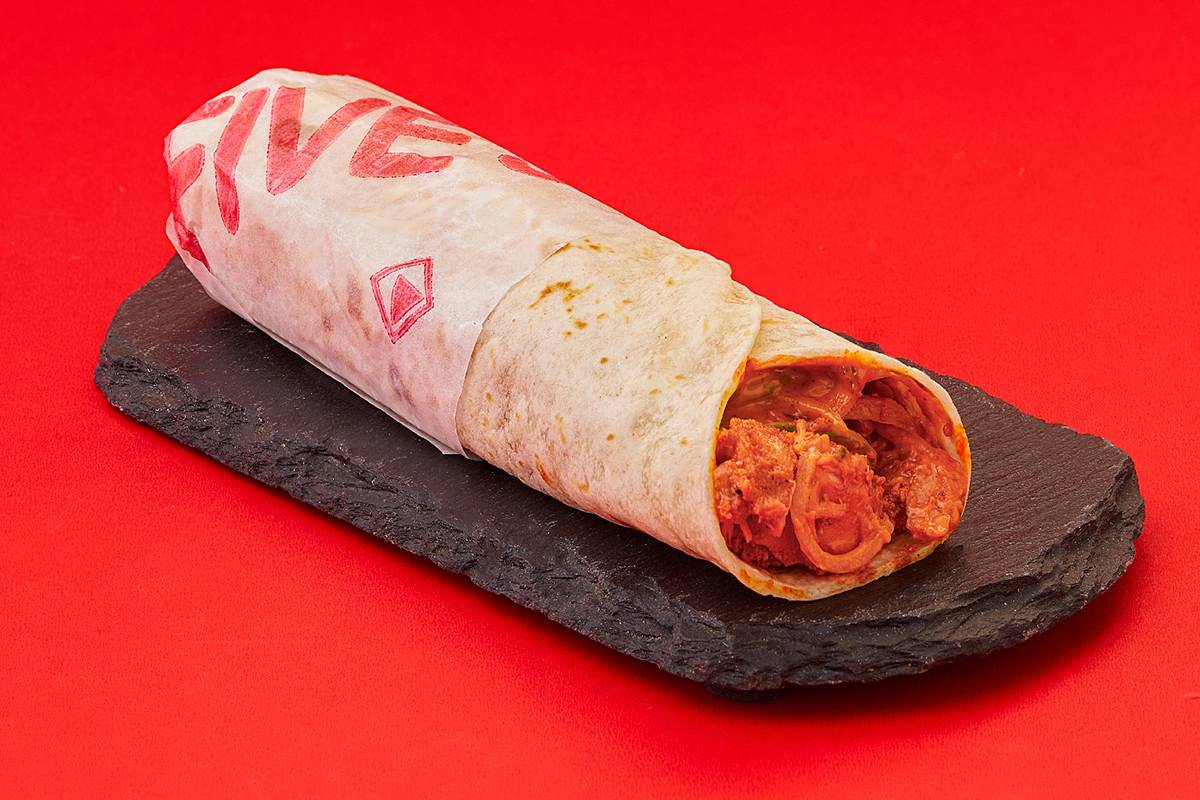 Crispy and spicy Krispy Chicken Roll filled with marinated chicken, served on a plate in Hyderabad.