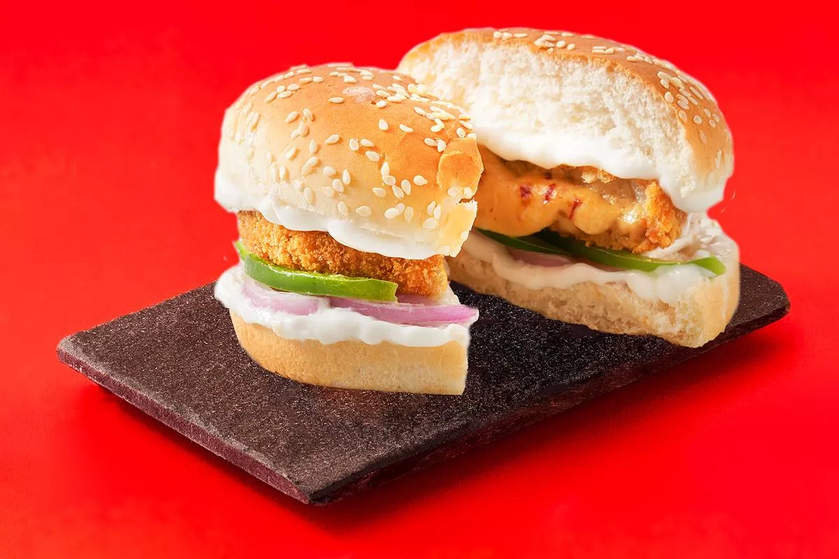 Delicious tangy and crunchy Veg Burger from FIVE STAR CHICKEN in Hyderabad, featuring fresh ingredients and vibrant colors.