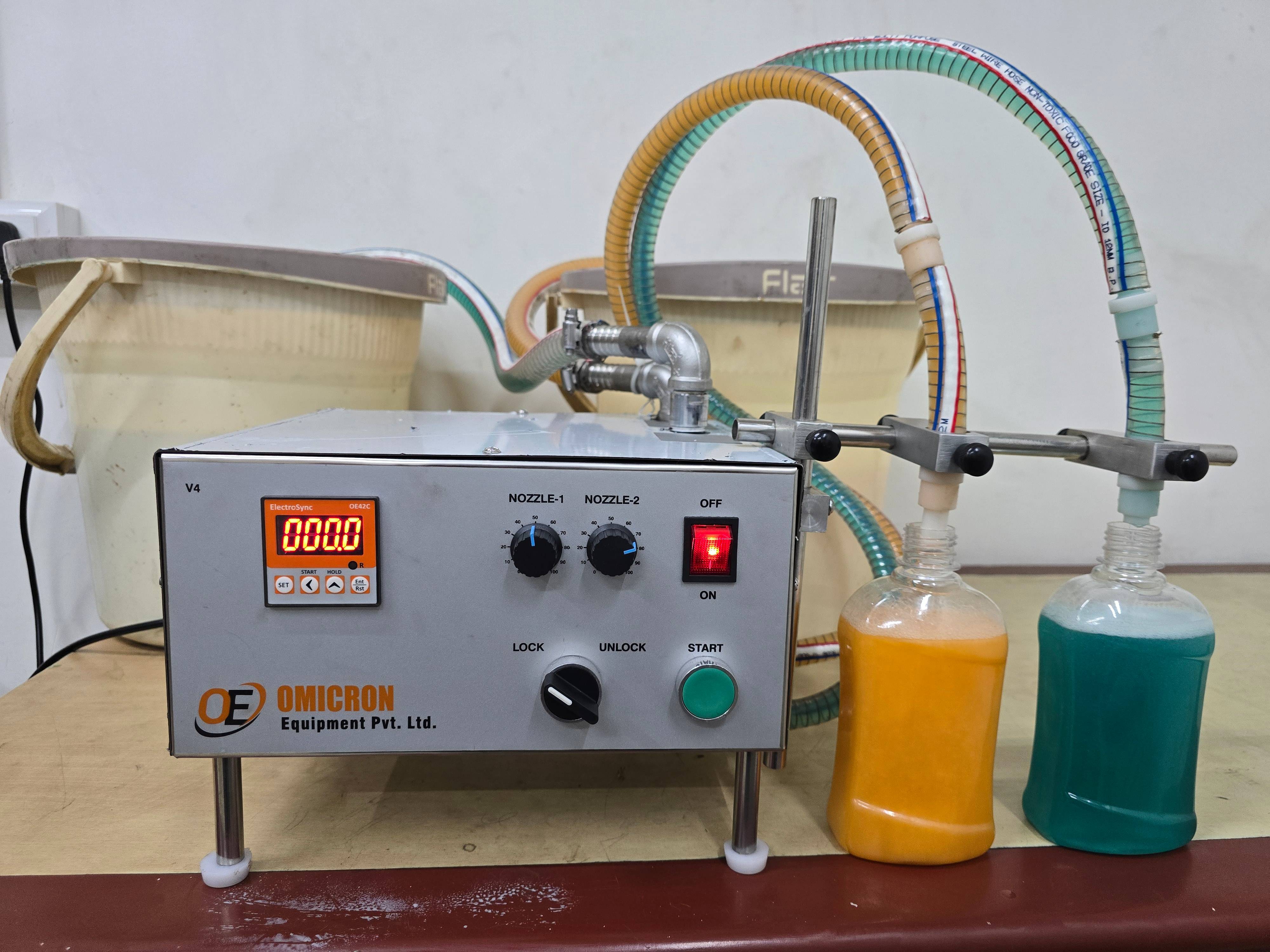 OMICRON EQUIPMENT PVT LTD - High Viscose Double Nozzle Liquid Filling Machine in in AHMEDABAD