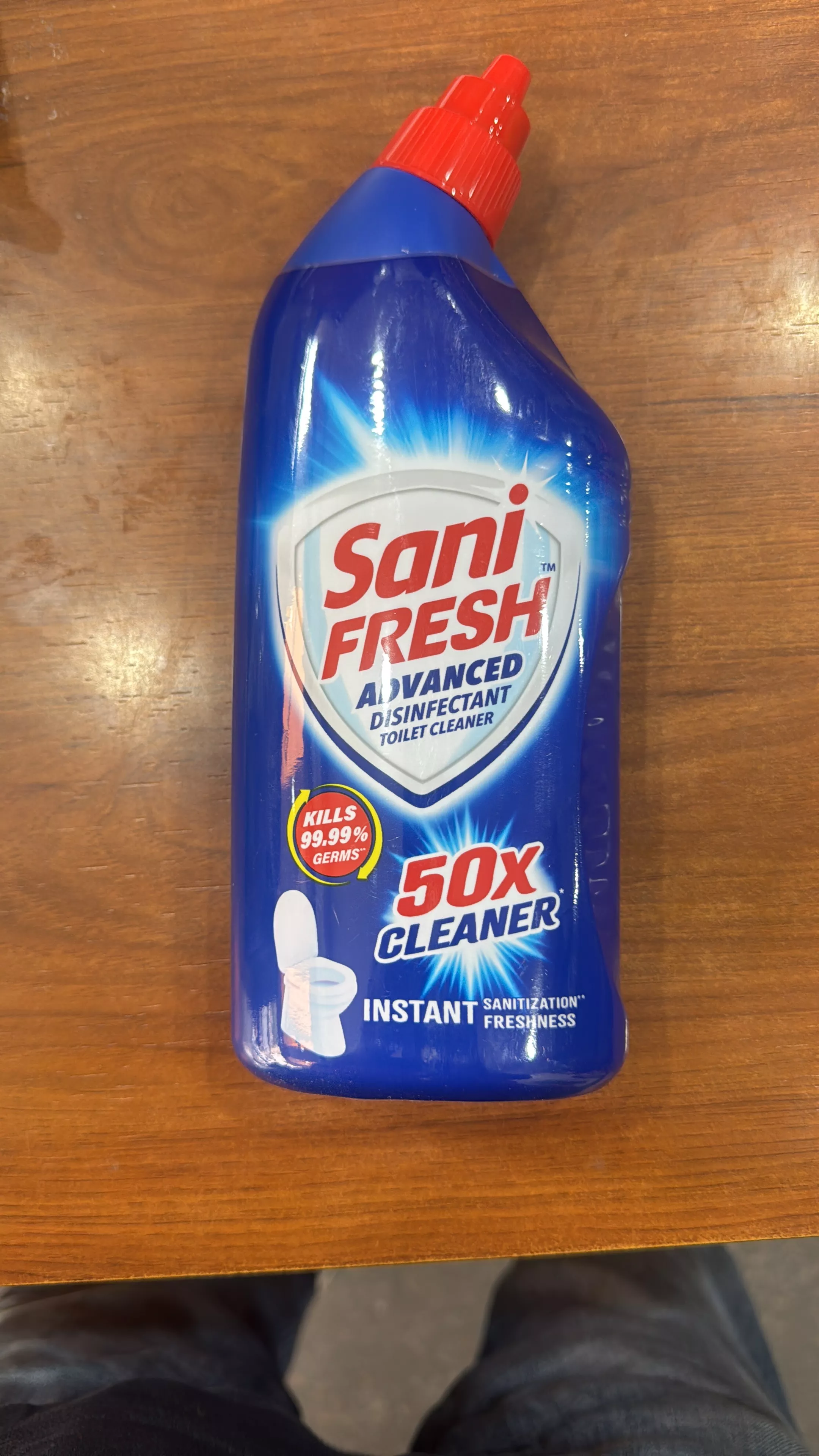 Sani Fresh Toilet Cleaner bottle on a clean bathroom surface in Phullanwala — effective disinfectant for germ-free toilets.