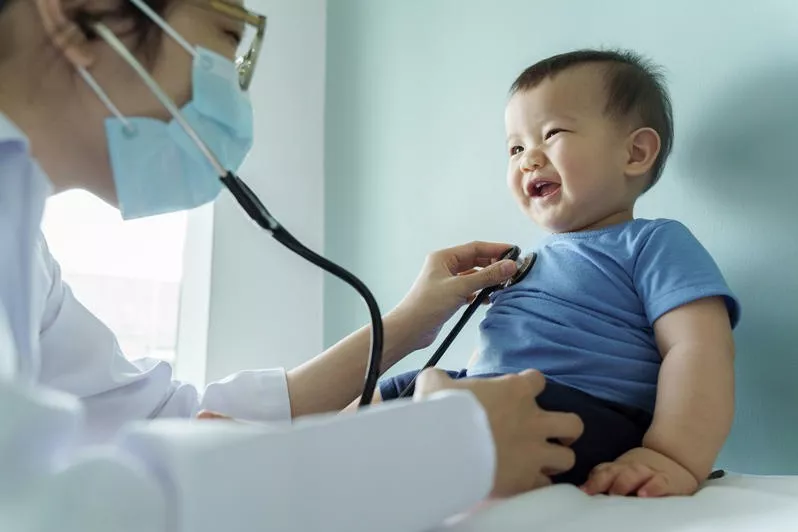 Paediatrician specialist examining a child at BAJWA CLINIC in Qadian — expert care for children's health