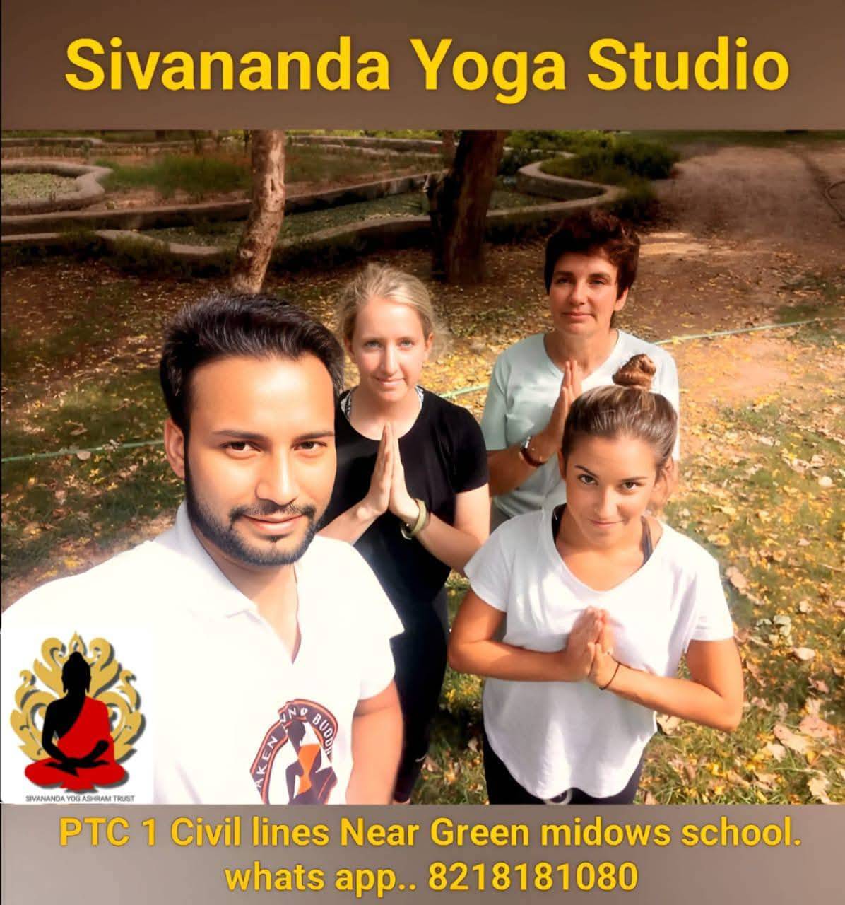 A serene yoga class taking place at the Int. Sivananda Yoga Studio in Moradabad, showcasing diverse participants practicing y