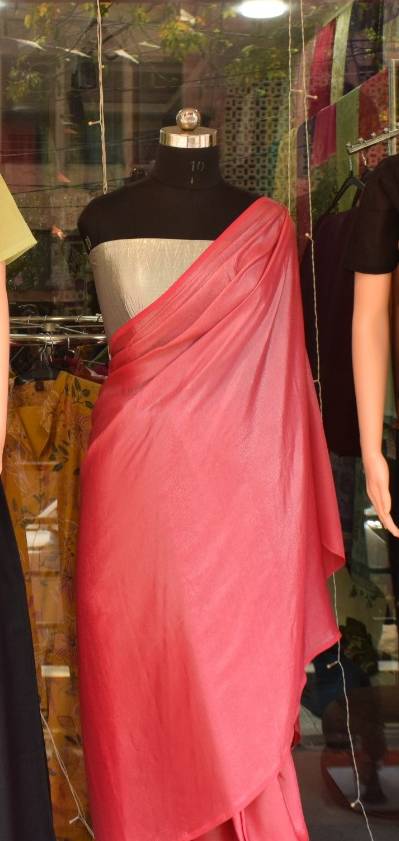 Elegant pink saree fabric displayed elegantly, showcasing its charming color and quality, available at SHEETESH SONI in GORAK