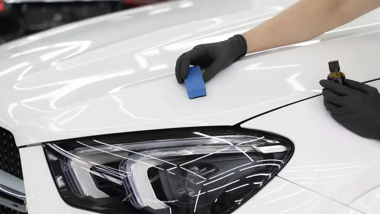 Premium ceramic coating applied to a car surface, showcasing a glossy shine in Imphal