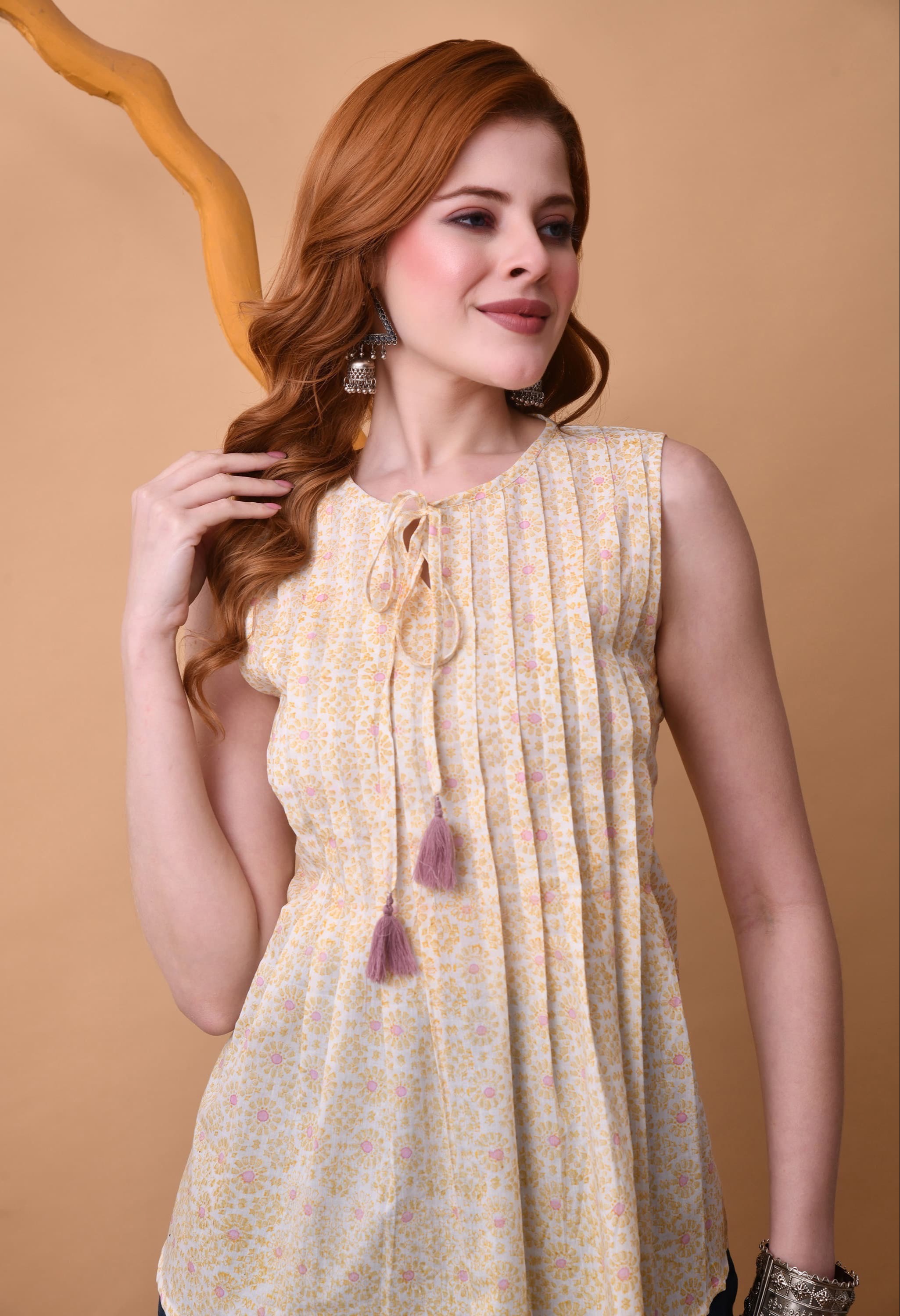Floral Print Sleeveless Tie-Up Neck Pleated Top in Jaipur with a vibrant floral design, perfect for summer outfits. - Image 4