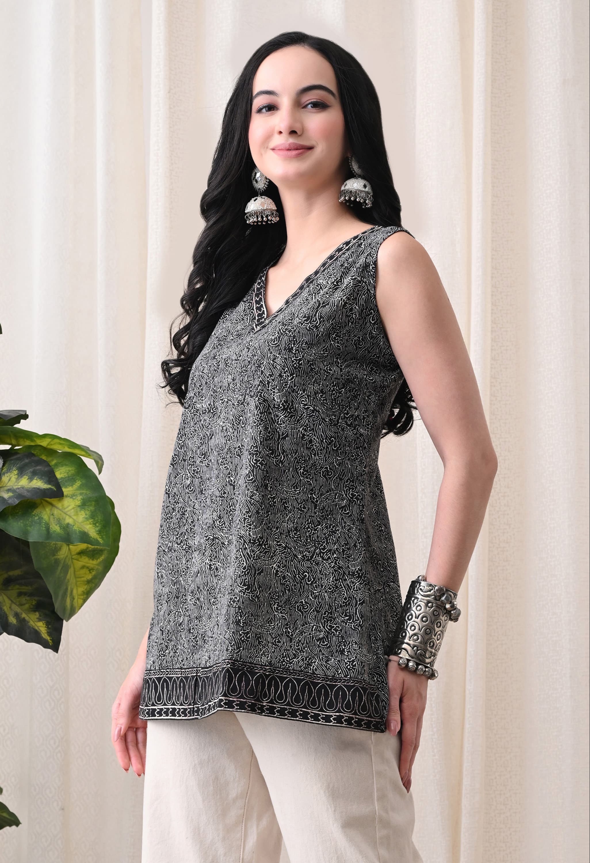 Stylish black sleeveless top with a tie-up neck design from CLICK KART in Jaipur, perfect for summer fashion.