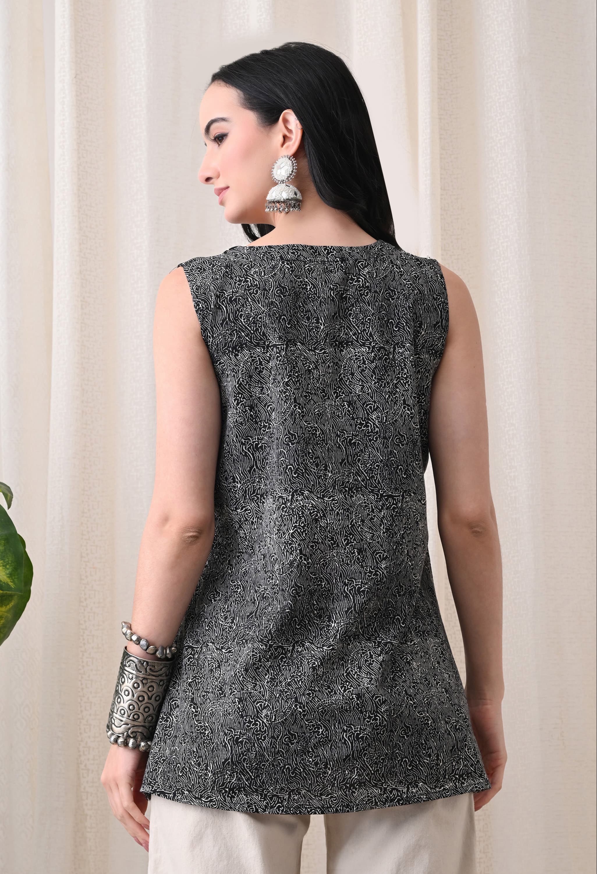 Stylish black sleeveless top with a tie-up neck design from CLICK KART in Jaipur, perfect for summer fashion. - Image 3