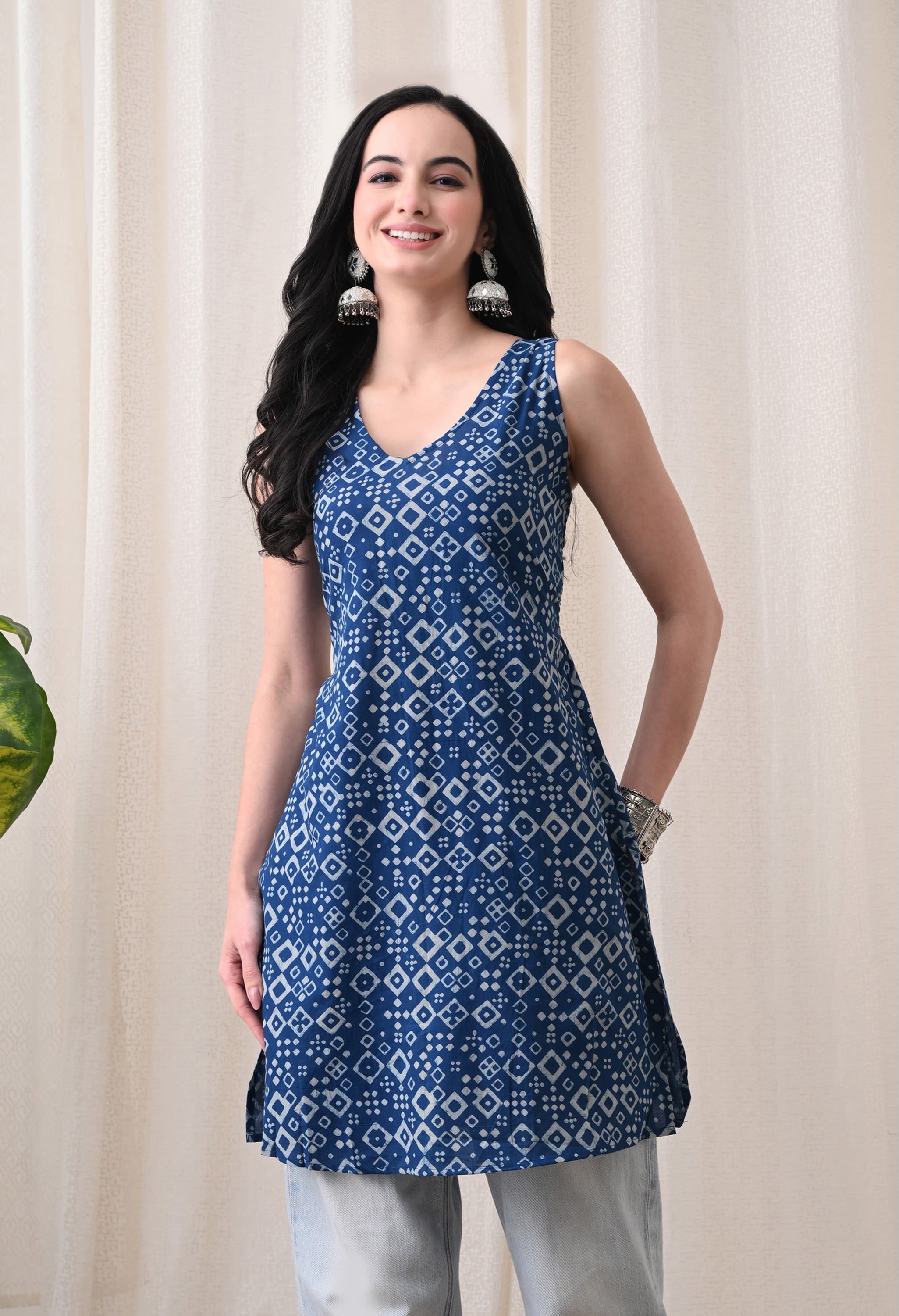 Chic indigo blue sleeveless smocked short kurti with geometric print, ideal for a modern wardrobe, from Kurti Vibe in Jaipur.
