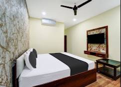 Luxury Bedroom Suite featuring elegant design and modern aesthetics in Dhanbad, complete with a stylish bed and matching furn