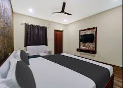 Luxury Bedroom Suite featuring elegant design and modern aesthetics in Dhanbad, complete with a stylish bed and matching furn - Image 1