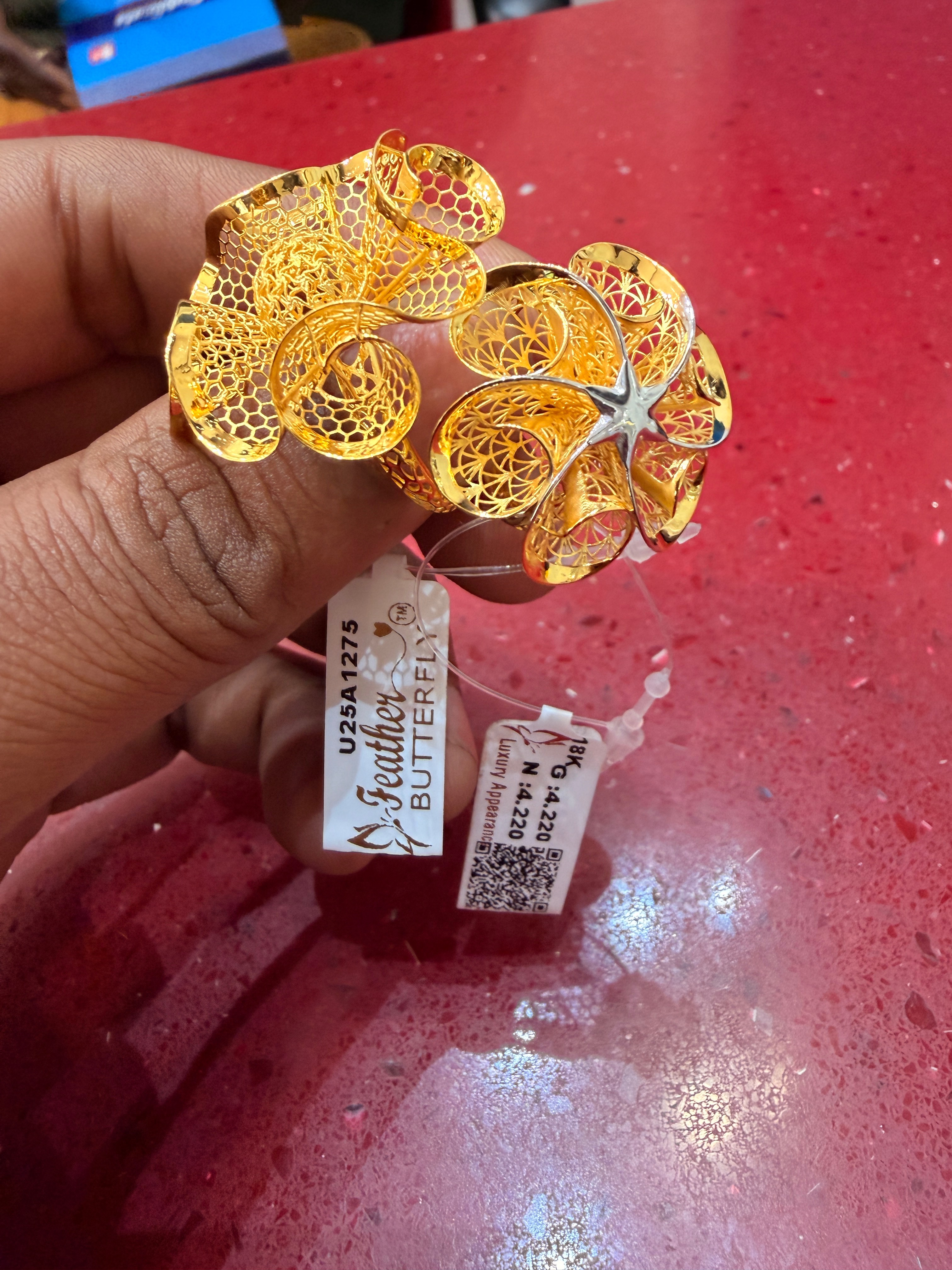 Exquisite 18k gold ring featuring a timeless design, showcased elegantly against a soft backdrop in Akbarpur.