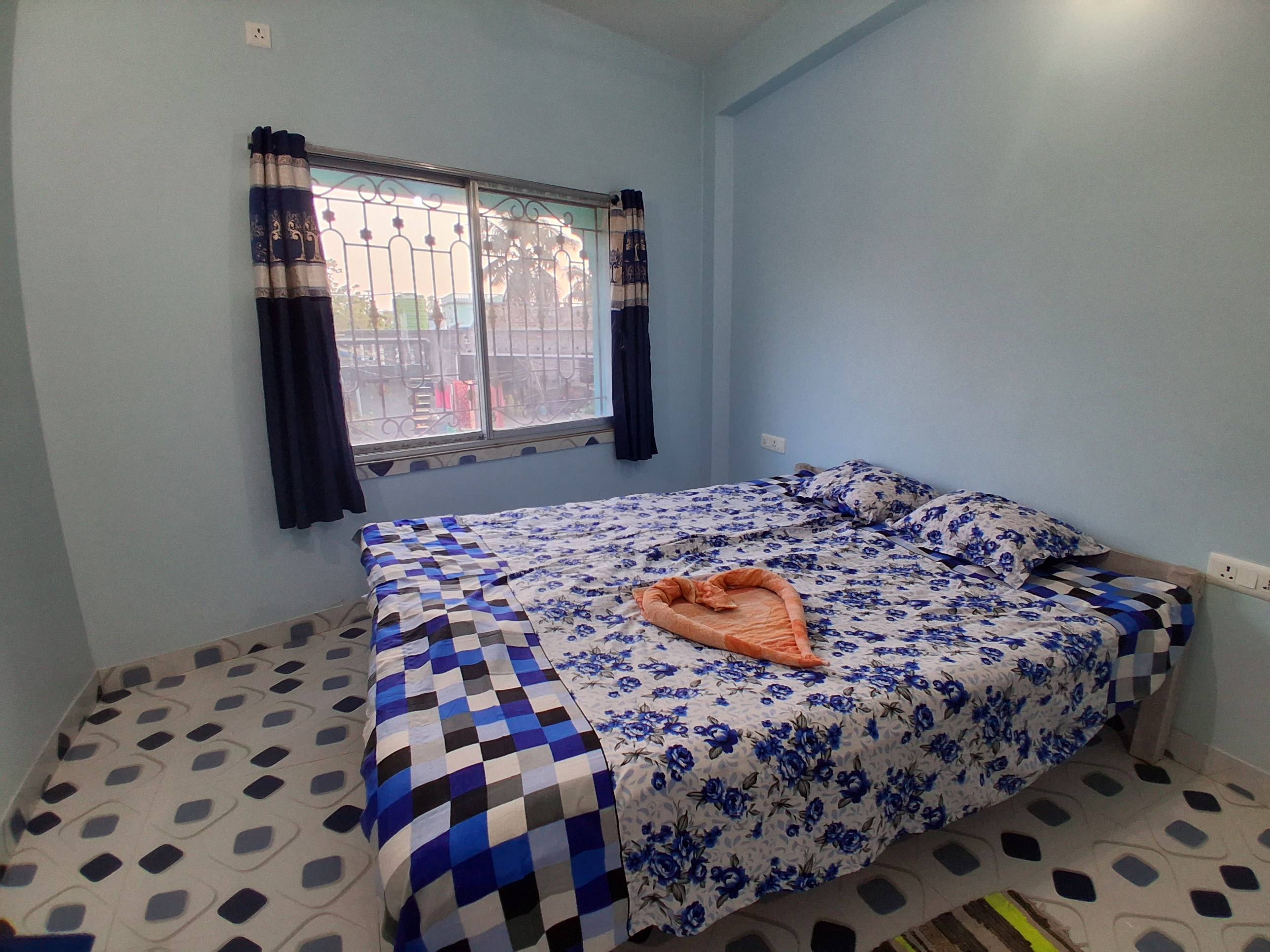 Elegant Couple Bedroom with a floral queen-sized cotton bedsheet and matching pillow covers, featuring a balcony view, locate - Image 2