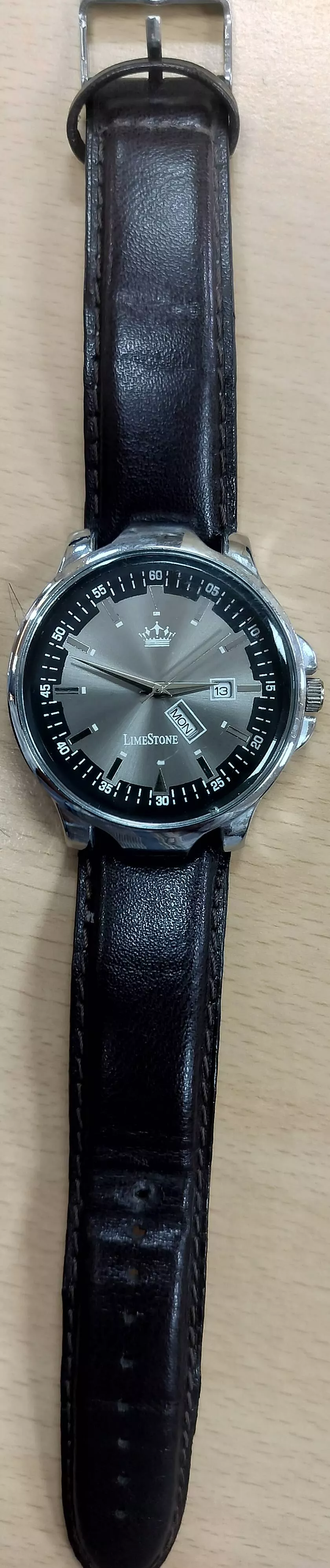LimeStone Analog Watch featuring a sleek leather strap and date function displayed on a white background, showcasing its styl