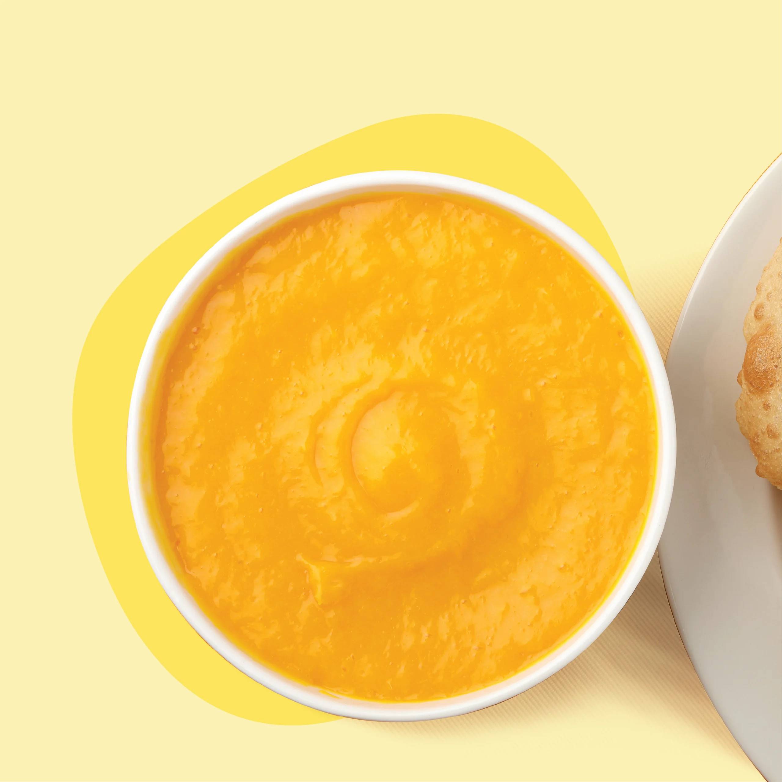 Delicious Aamras Majur dessert featuring creamy mango puree served in a bowl, garnished with a hint of saffron, from HOTEL DA