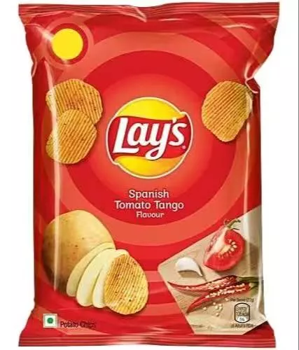 Lay's Potato Chips in Gurdaspur featuring a vibrant packaging design with a tangy tomato theme, showcasing crispy chips insid - Image 1