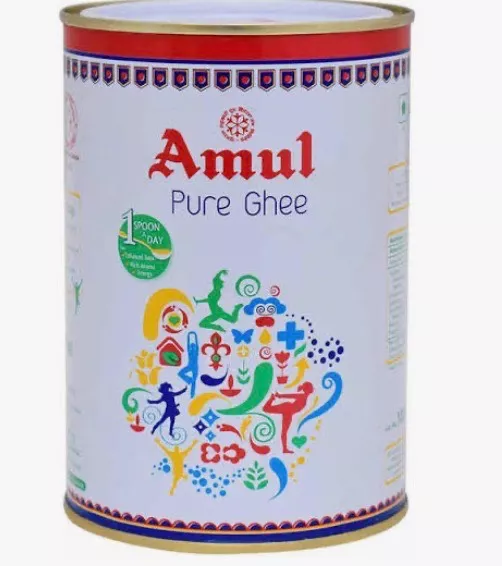 Amul Pure Ghee in a clear container showcasing its rich golden color, ideal for cooking and baking, available at VIKRAM KARYA