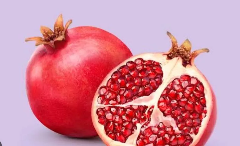 Fresh pomegranate fruits with vibrant red seeds in Yellandu, showcasing their juicy texture and health benefits