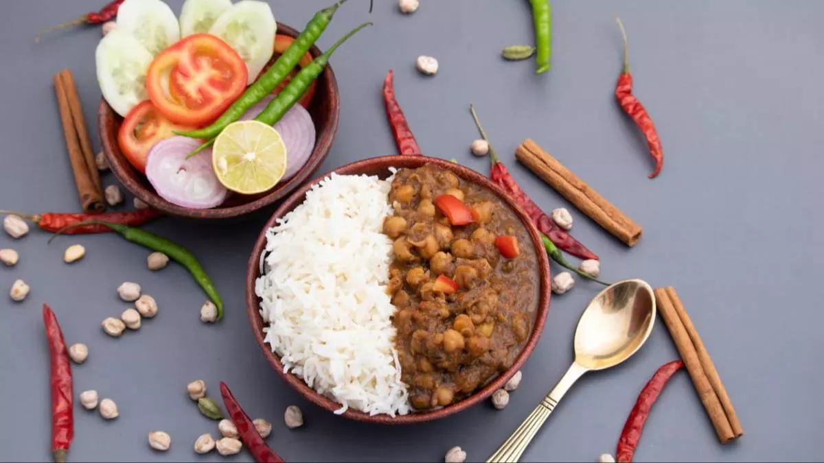 Delicious Chole Rice served with traditional Indian spices, featuring fluffy basmati rice and vibrant chole, at Sizzling Tawa