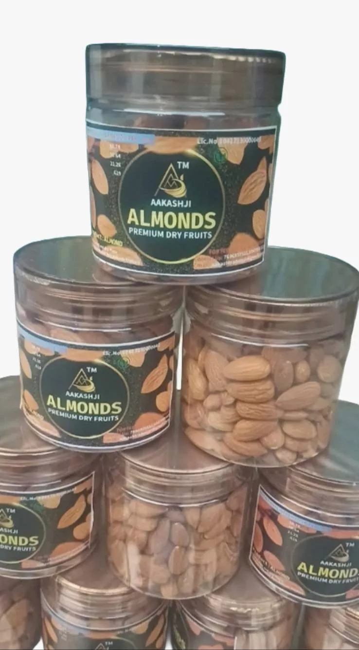 Aakashji Premium Almonds in a decorative bowl showcasing their natural color and texture, sourced from AAKASH TRADERS in Tajp
