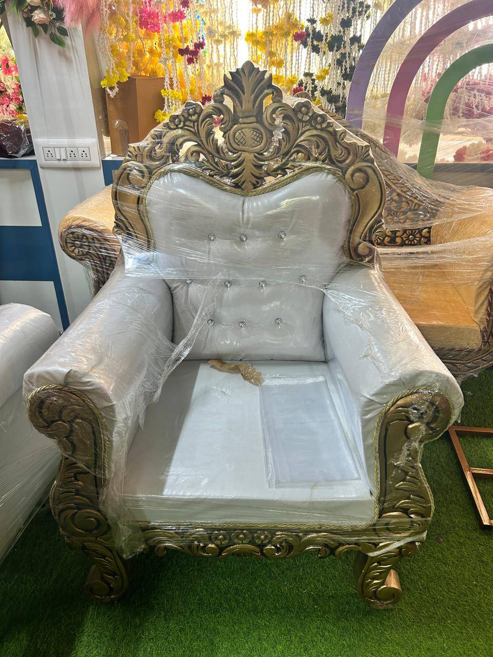 Luxury Upholstered Armchair in Khata Kheri with Ornate Wood Carvings, featuring rich upholstery and intricate wood detailing,