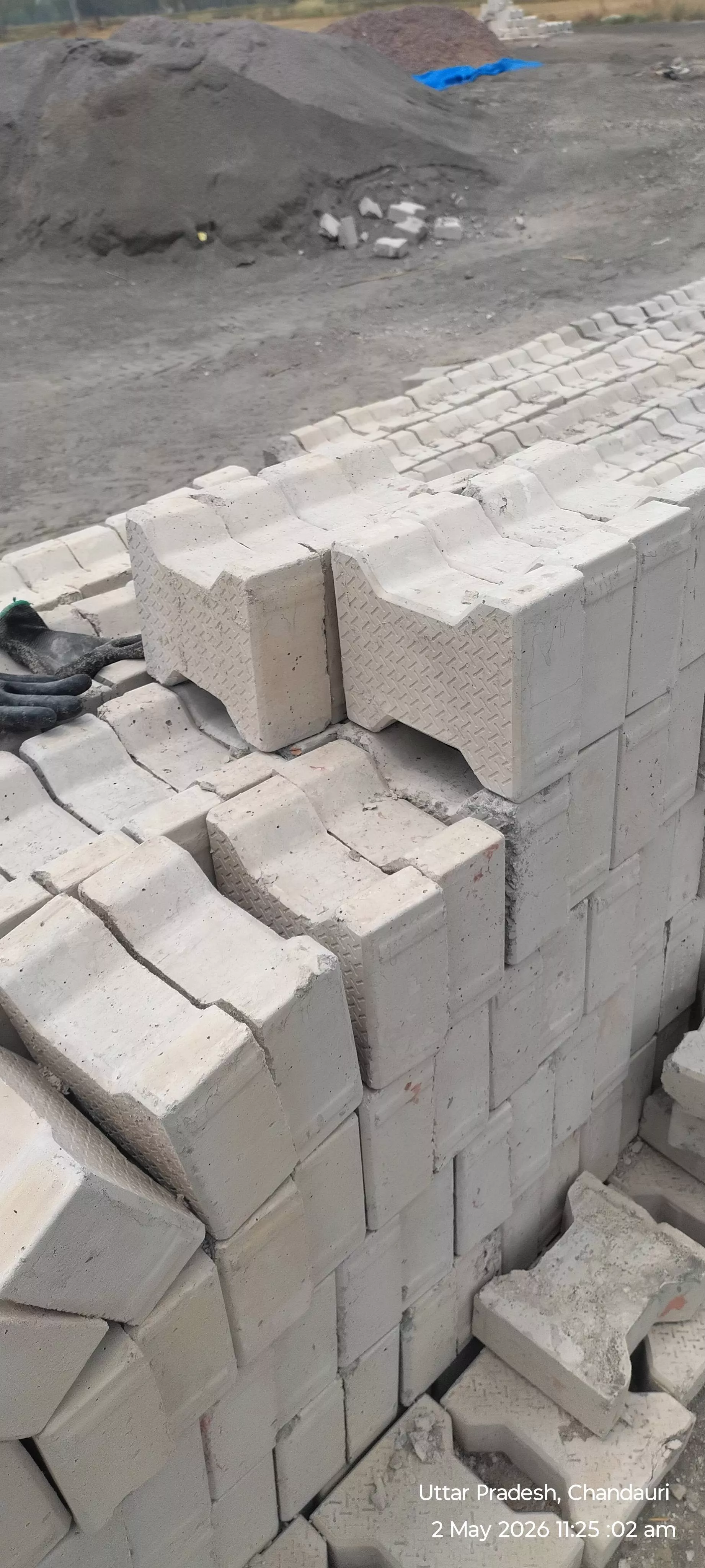 High-quality bricks suitable for construction, displayed in a stack at PSR ENTERPRISES in Mathura, showcasing their durabilit