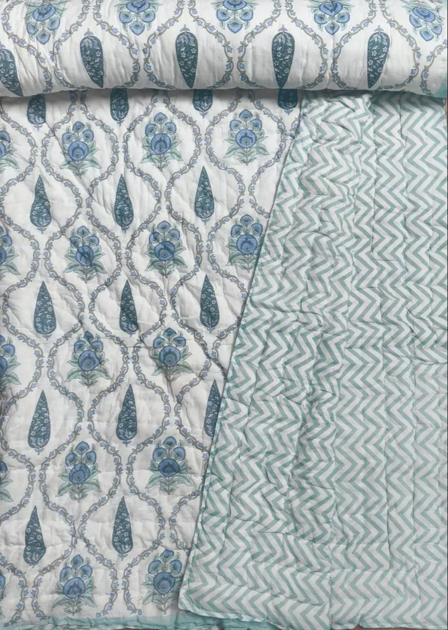 Reversible double-bed Jaipur Quilt featuring intricate designs and vibrant colors, ideal for enhancing bedroom aesthetics, av