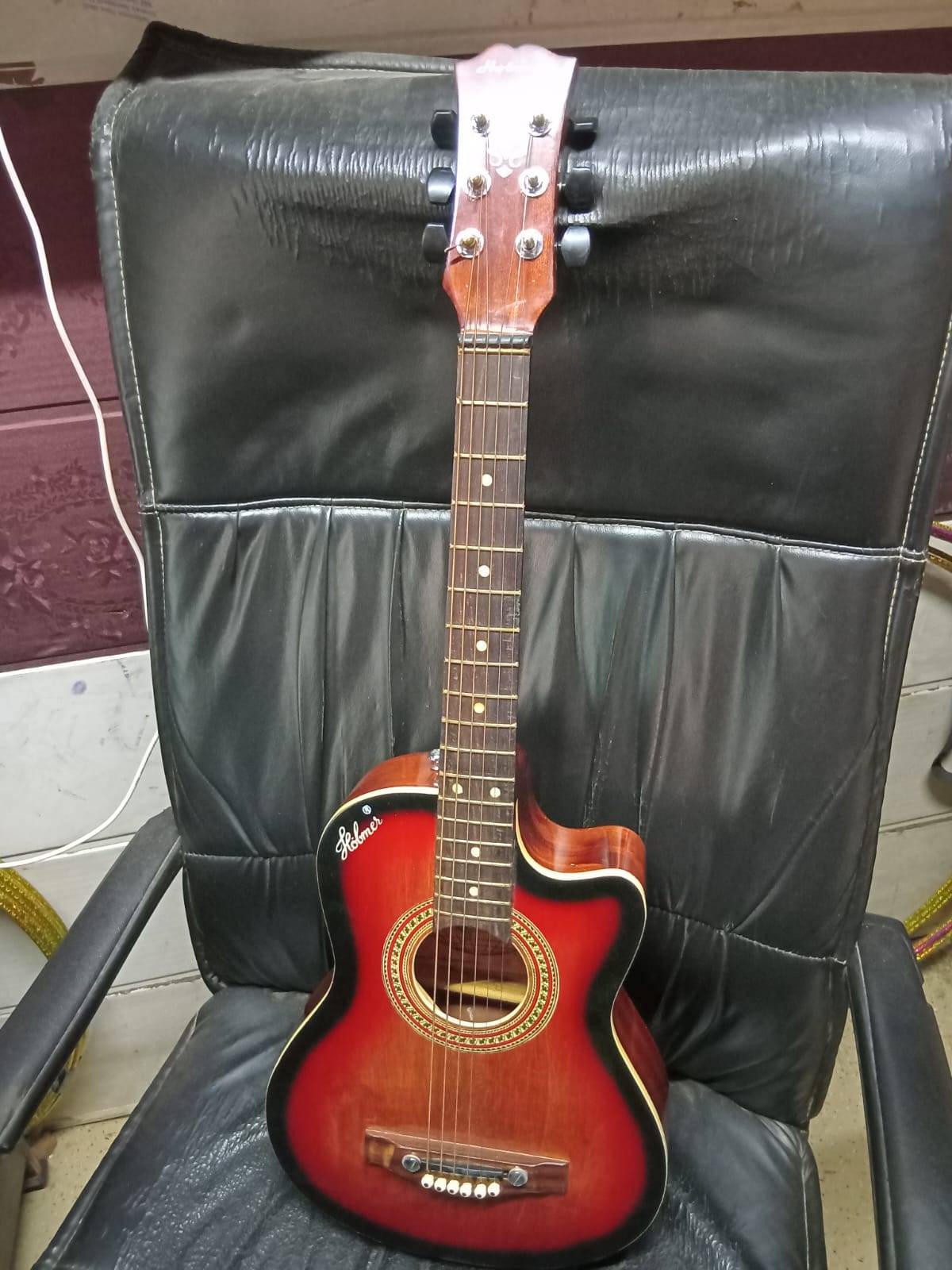Compact and lightweight Ukulele Guitar made from high-quality wood, featuring a melodious sound, available at MELODY MAKERS I