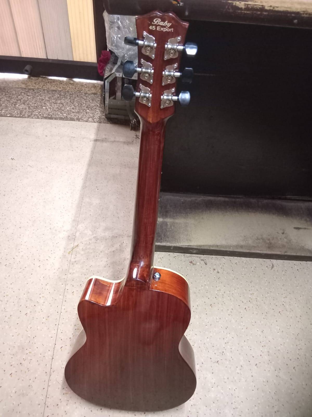Compact and lightweight Ukulele Guitar made from high-quality wood, featuring a melodious sound, available at MELODY MAKERS I - Image 1
