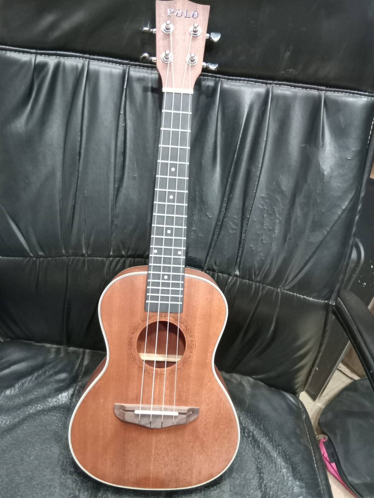 Compact and lightweight Ukulele Guitar made from high-quality wood, featuring a melodious sound, available at MELODY MAKERS I - Image 2