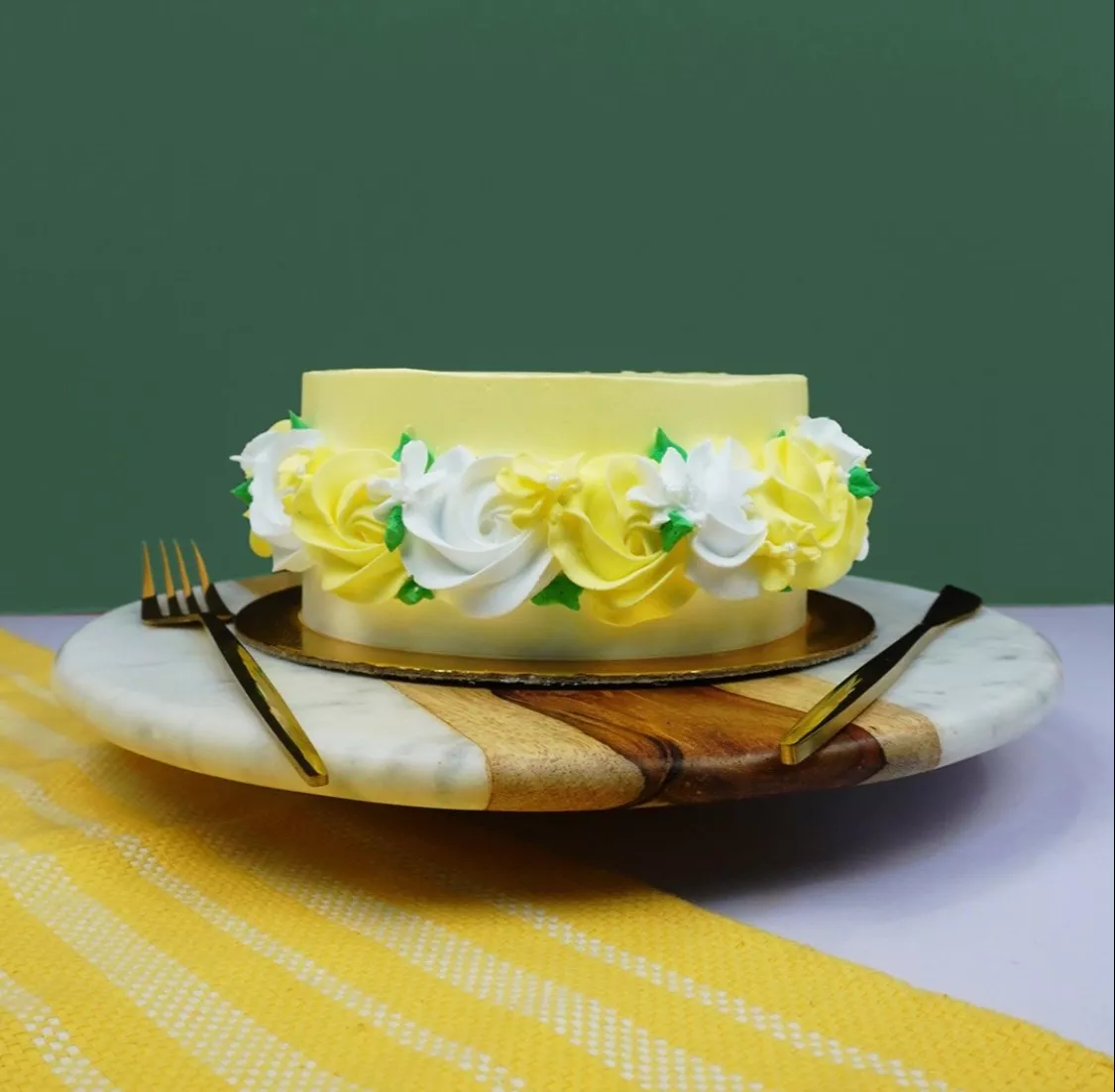 Golden Pinapple Delight Cake from MUMMALICIOUS in Bangalore, featuring a golden-brown crust, topped with fresh pineapples and