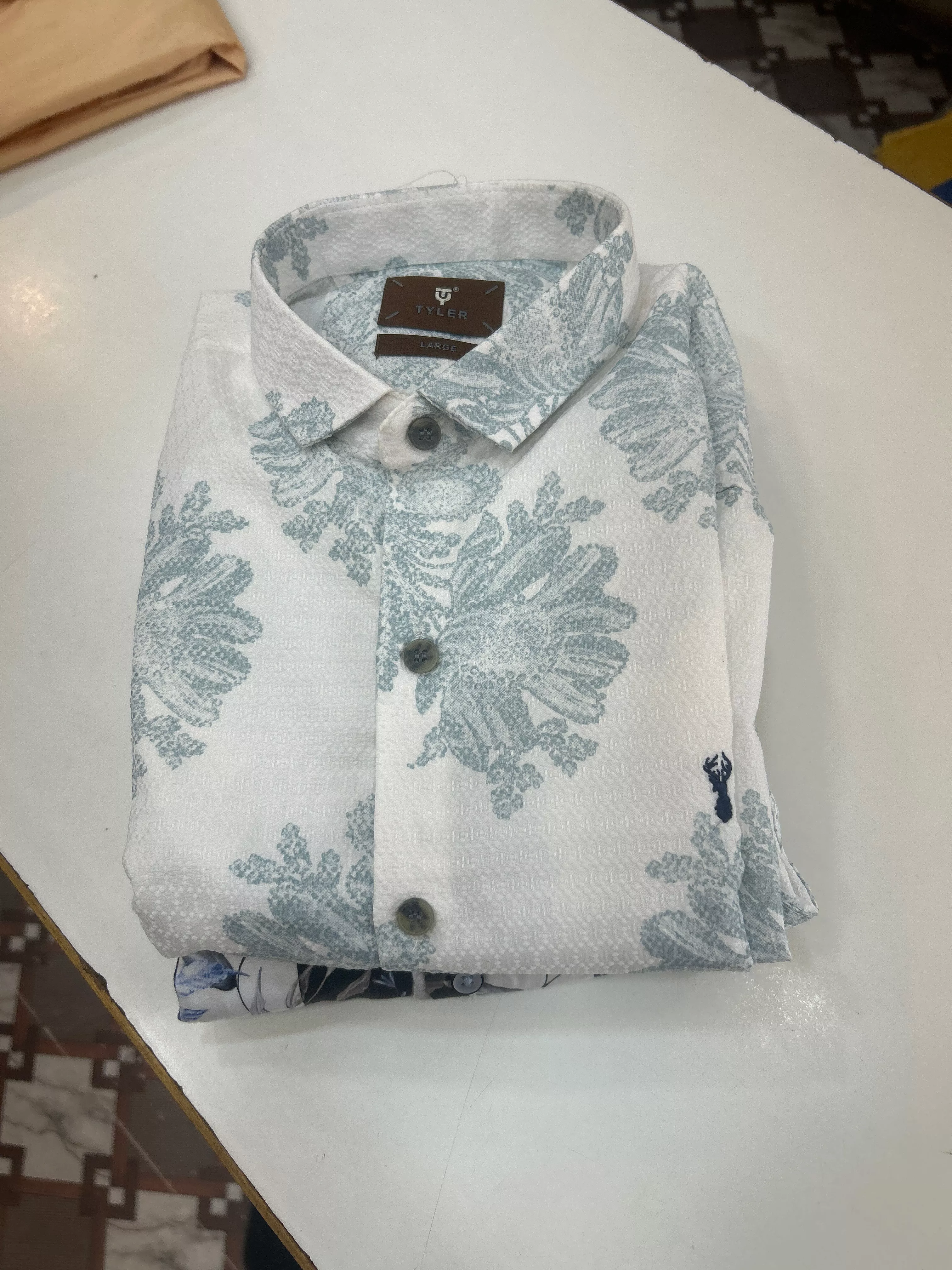 Elegant white RANJITH FASHIONS Shirt displayed on a mannequin, showcasing its stylish design in Yellandu.