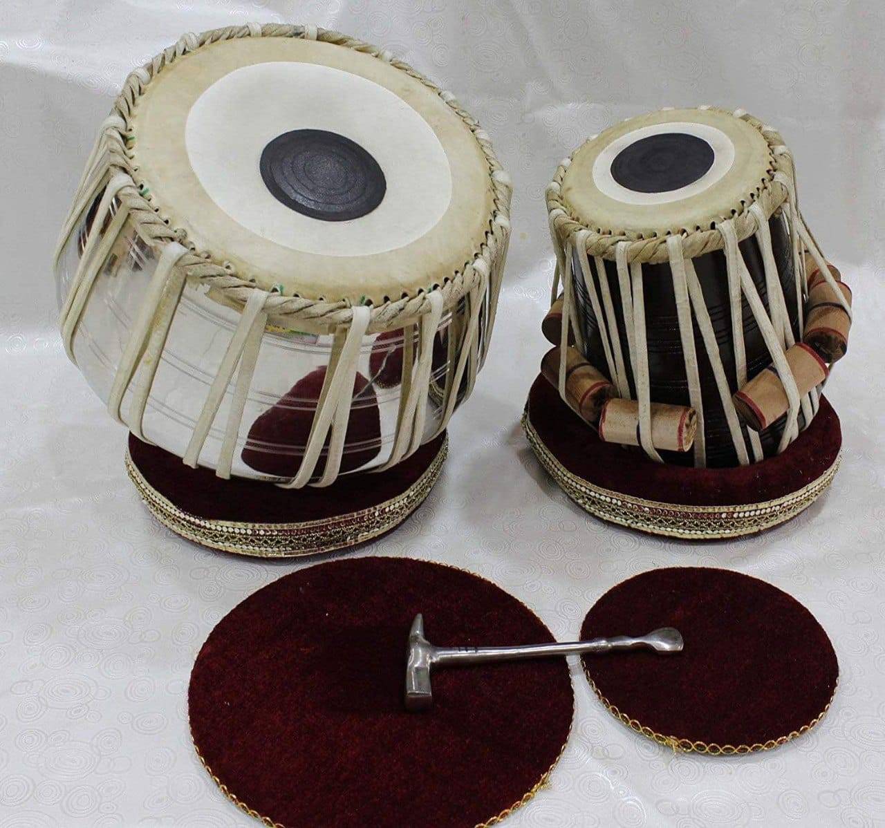 Steel Tabla Set featuring stainless steel drums and intricate craftsmanship, ideal for enhancing musical experiences, availab