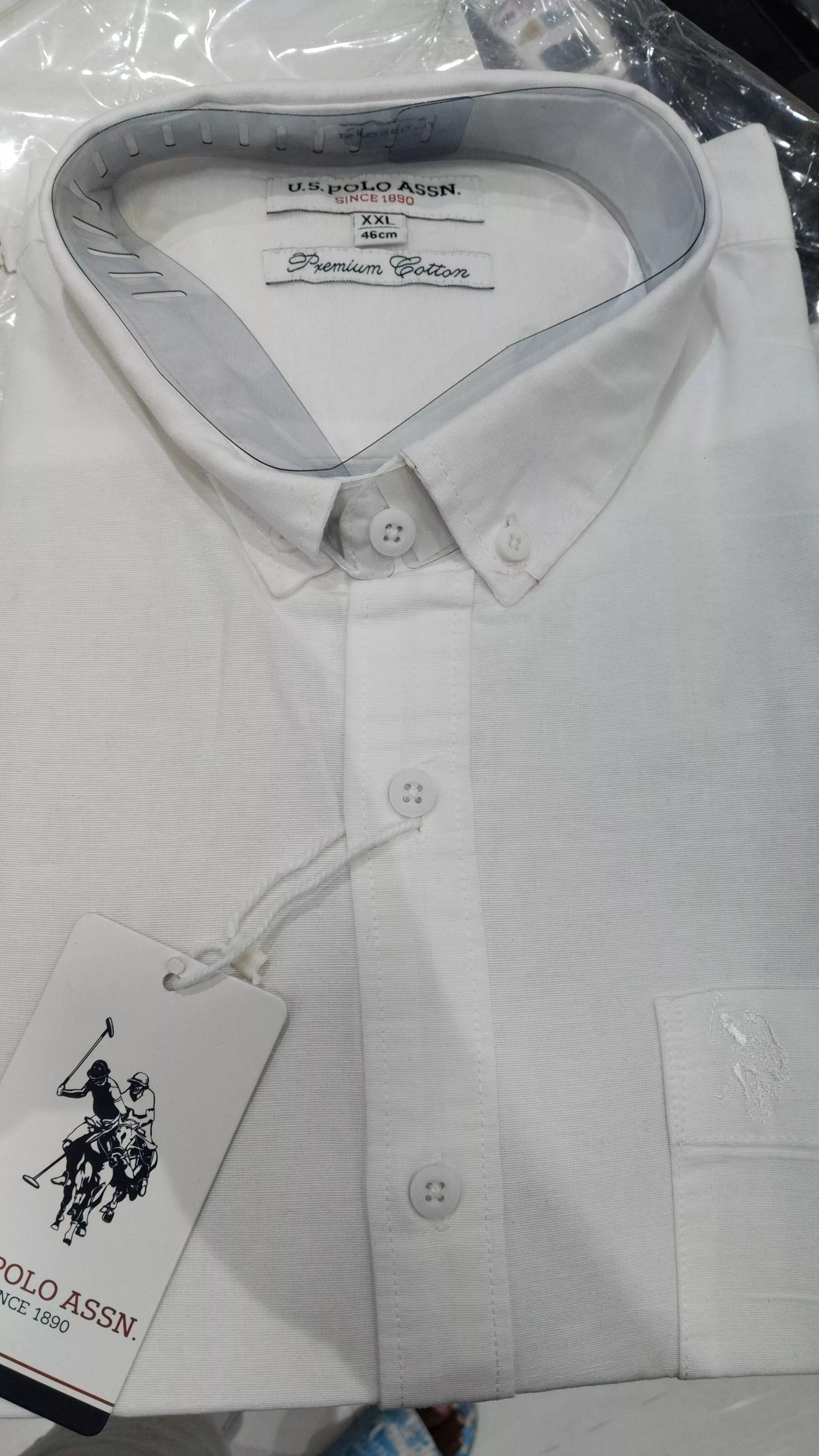 Classic white U.S. Polo Assn. Premium Cotton Shirt with button-down collar, showcasing premium quality fabric in Vijayawada. - Image 1