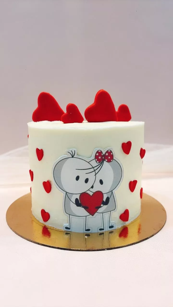 Delicious Couple themed cake decorated with romantic elements in Bangalore, showcasing rich flavors and beautiful design.
