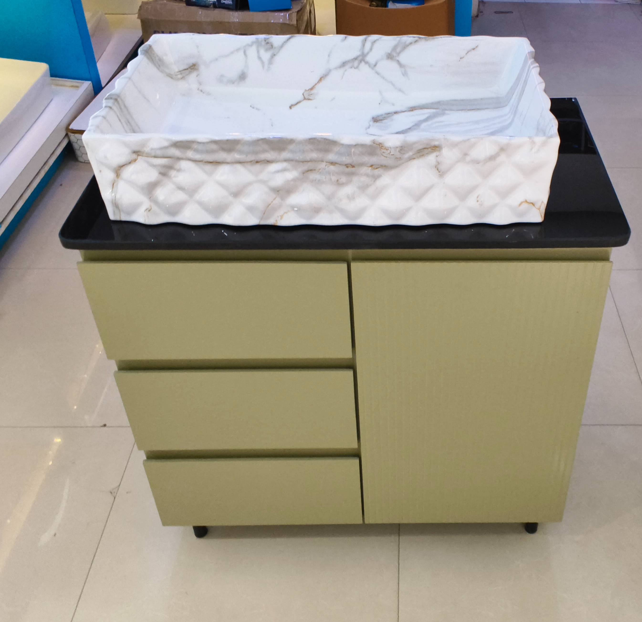 Elegant marble finish wash basin with storage cabinet displayed in a modern bathroom setting in Samalkha
