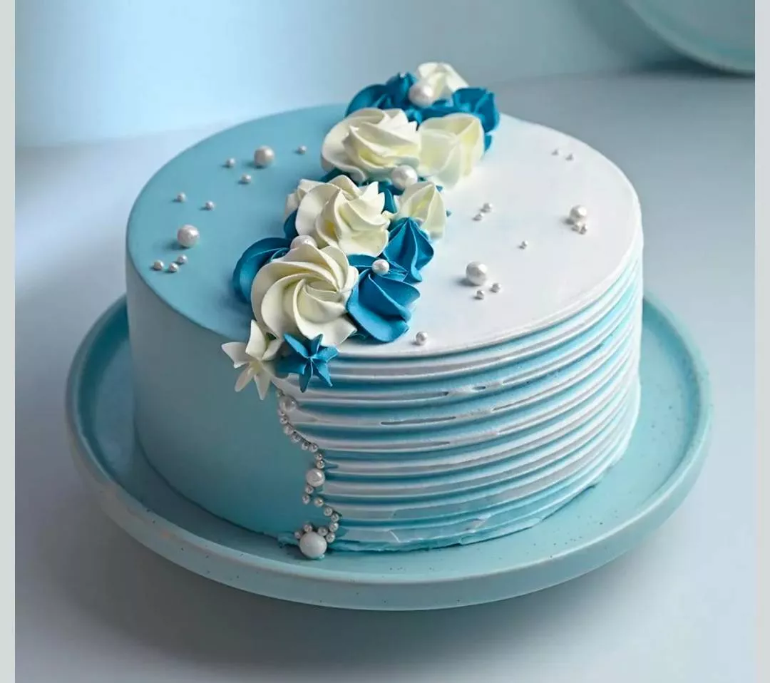 Elegant blue and white floral cake featuring intricate decorations, perfect for celebrations located in Palvancha.