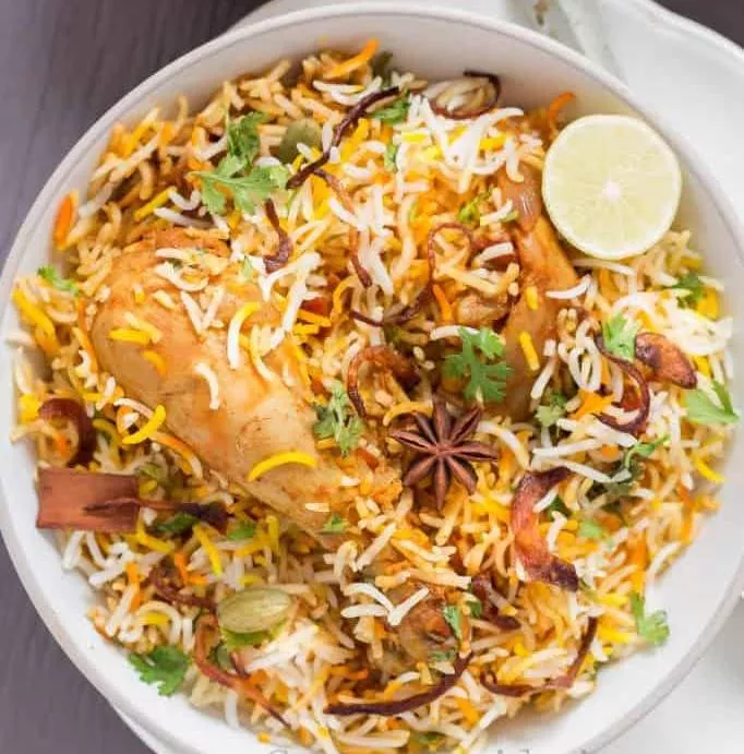 Delicious Chicken Dum Biryani with tender chicken pieces and aromatic basmati rice served at BALAJI GRAND in Sindhanoor