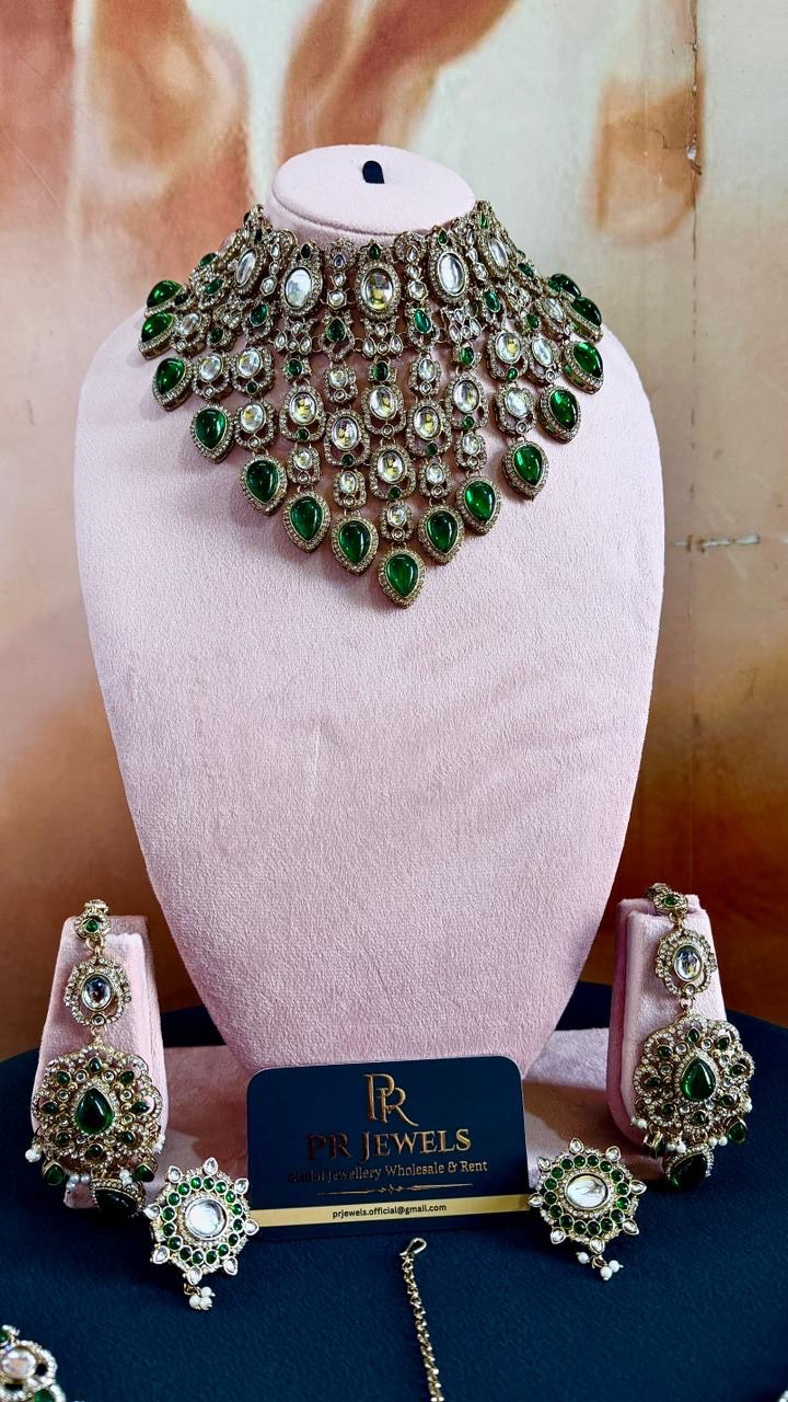 Elegant Royal Green and White Kundan Necklace Set displayed on a soft fabric in Hathras, showcasing intricate designs and vib