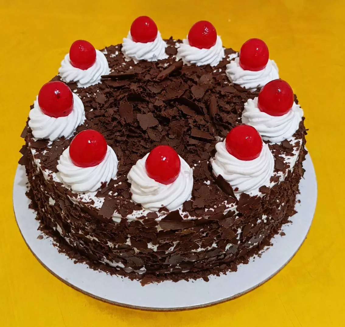Decadent Black Forest Cake with layers of chocolate and cherries at VARNIKA PATISSERIE in Bangalore