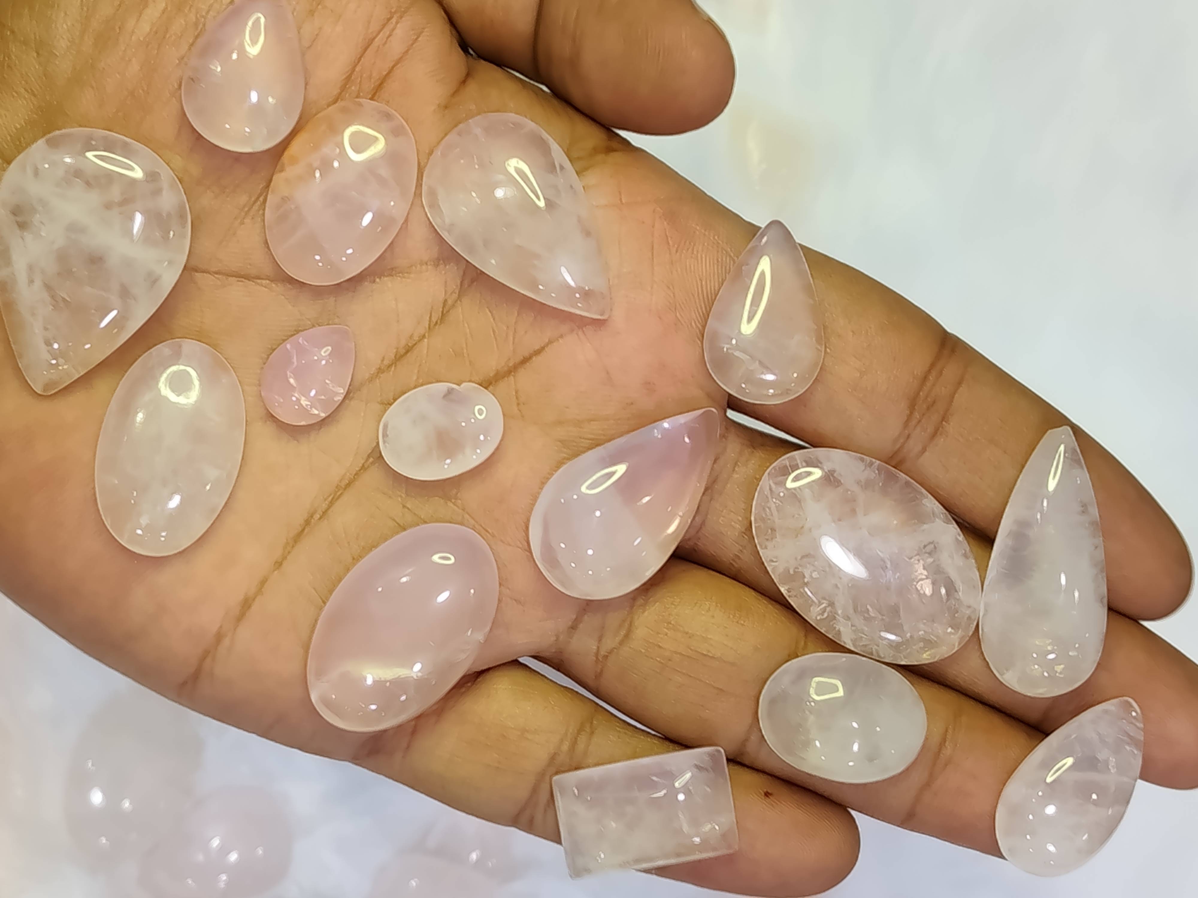 Natural rose quartz stone from Ayeza Gems in Alipura, showcasing its soft pink hue and smooth surface, ideal for emotional he - Image 1
