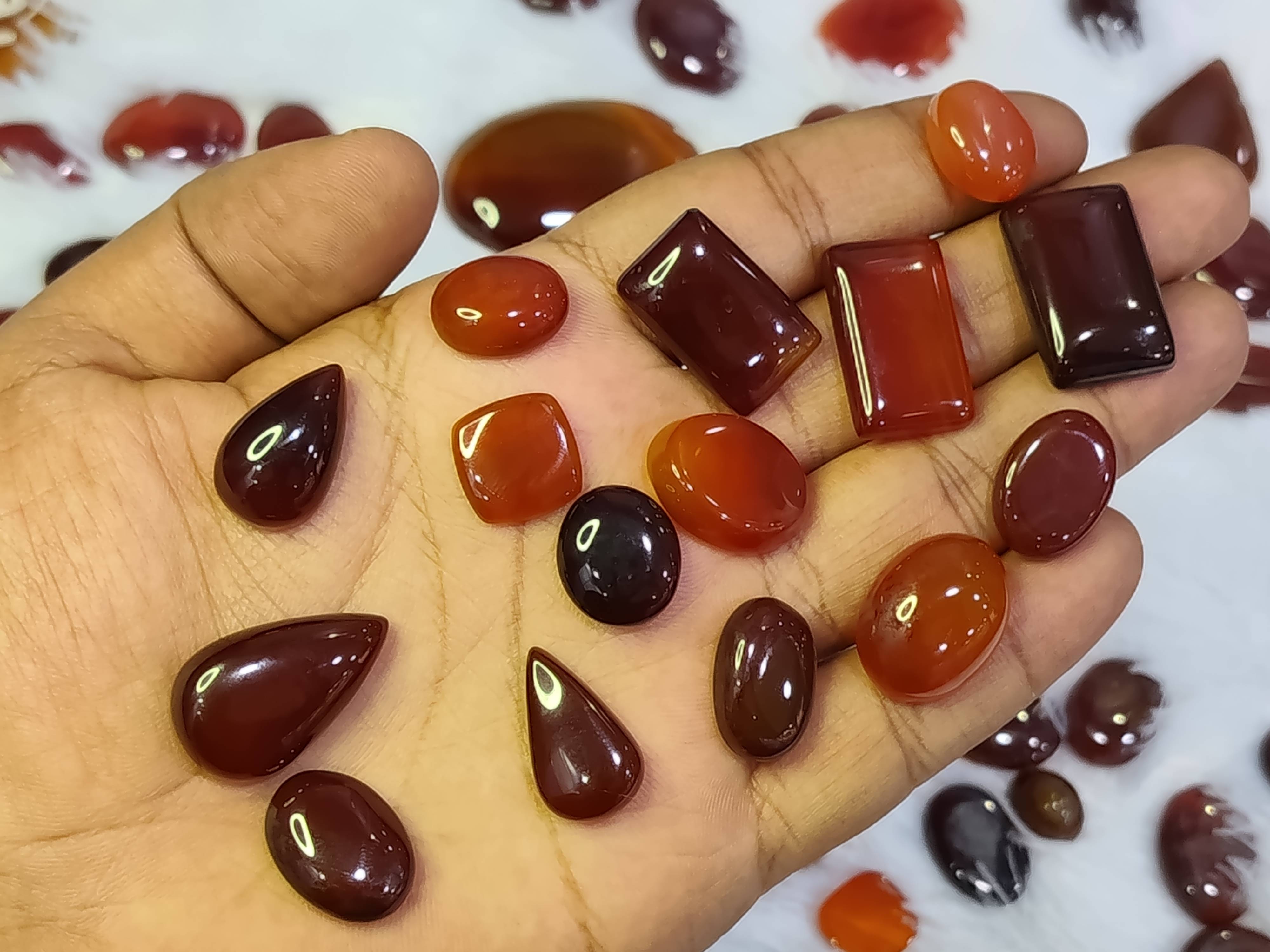 Natural Haqeeq gemstones from AYEZA GEMS displayed in Alipura, featuring vibrant colors and unique textures that promote stre - Image 1