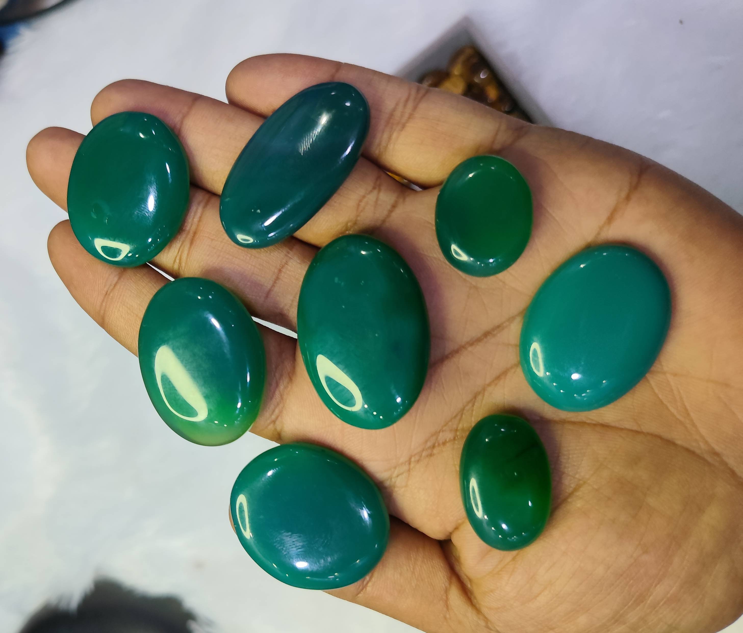 Natural Haqeeq gemstones from AYEZA GEMS displayed in Alipura, featuring vibrant colors and unique textures that promote stre - Image 2