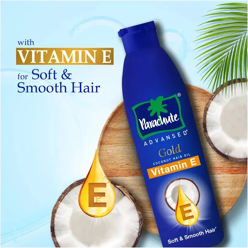 Bottle of Parashute Oil enriched with natural ingredients, showcasing its vibrant packaging against a white background, highl