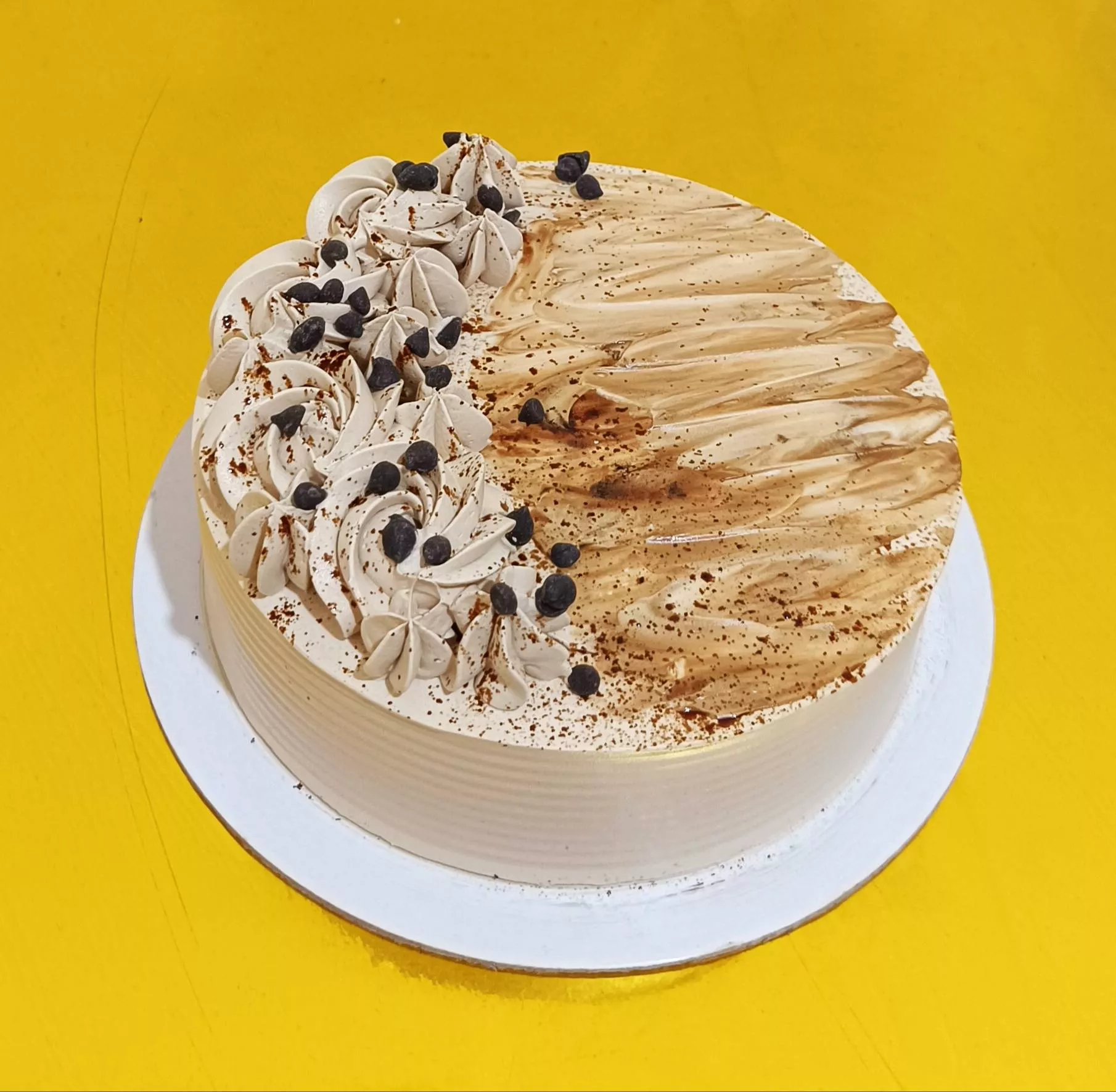 Delicious Coffee Mocha Cake topped with chocolate and coffee frosting, showcasing rich layers, from VARNIKA PATISSERIE in Ban