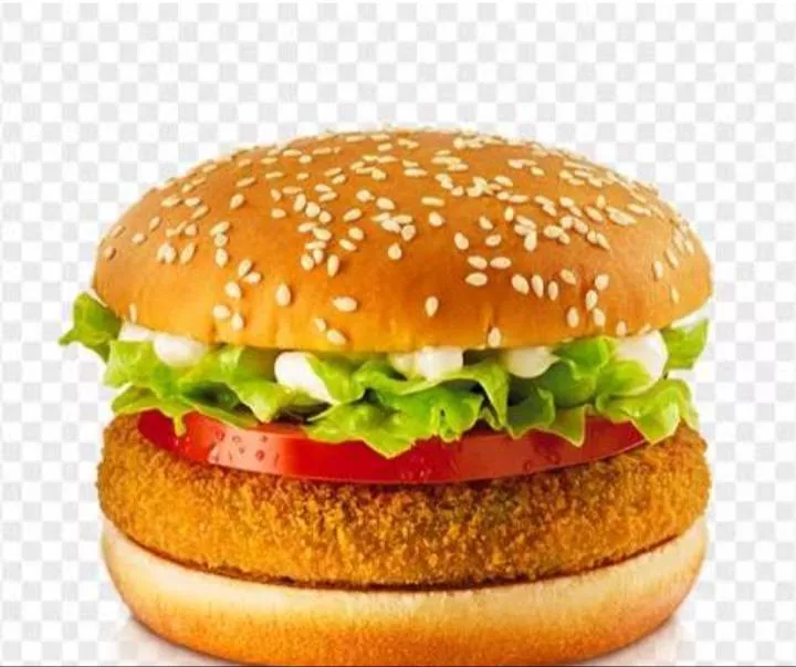 A delicious Hangover Burger featuring a crispy veggie patty and fresh vegetables in a sesame bun, served at FOUR 10 CAFE in B