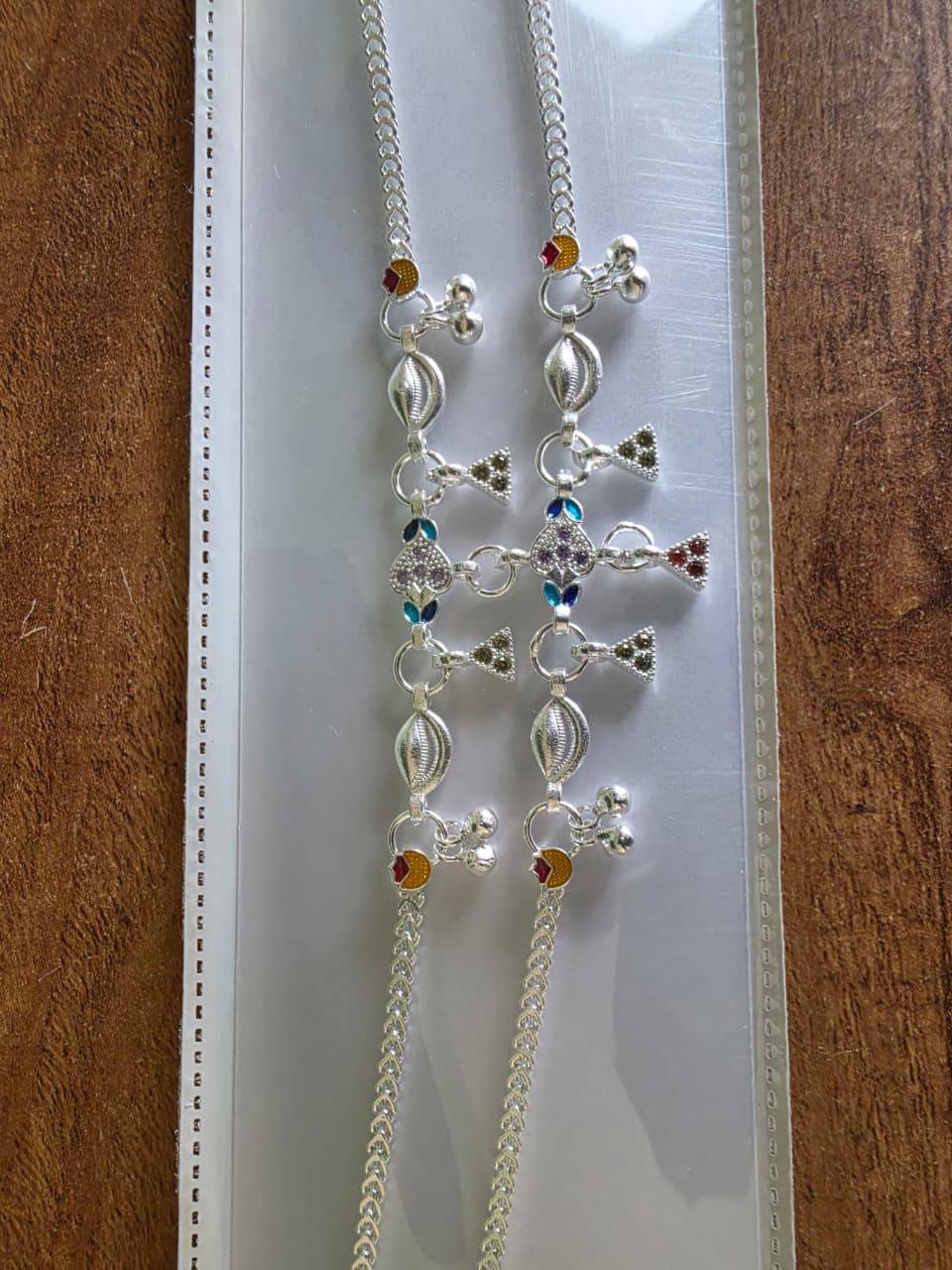 Elegant Agra Payal in silver displayed against a soft fabric background in Sangli
