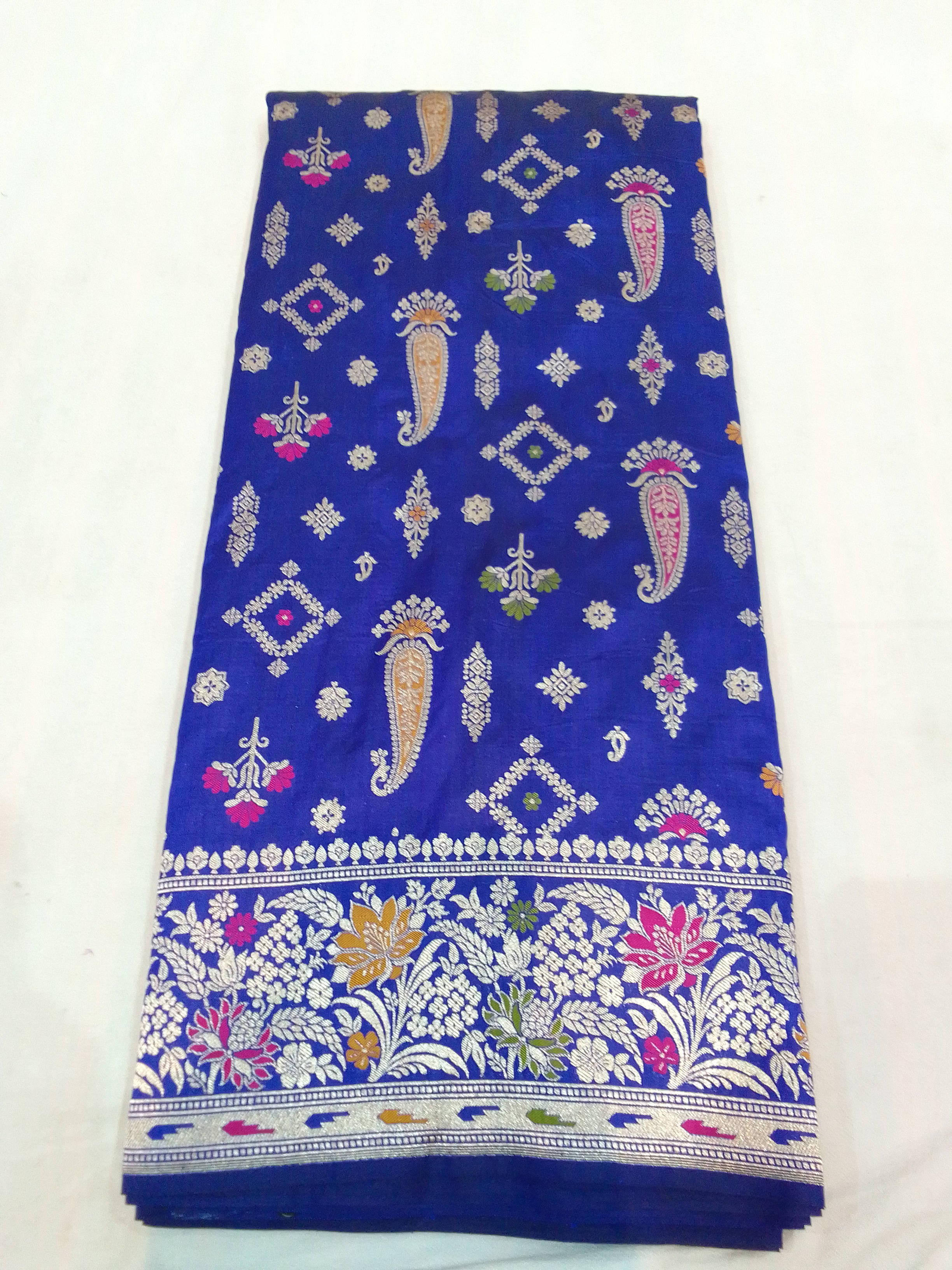 Pure Silk Banarasi Saree with golden zari work displayed in Varanasi